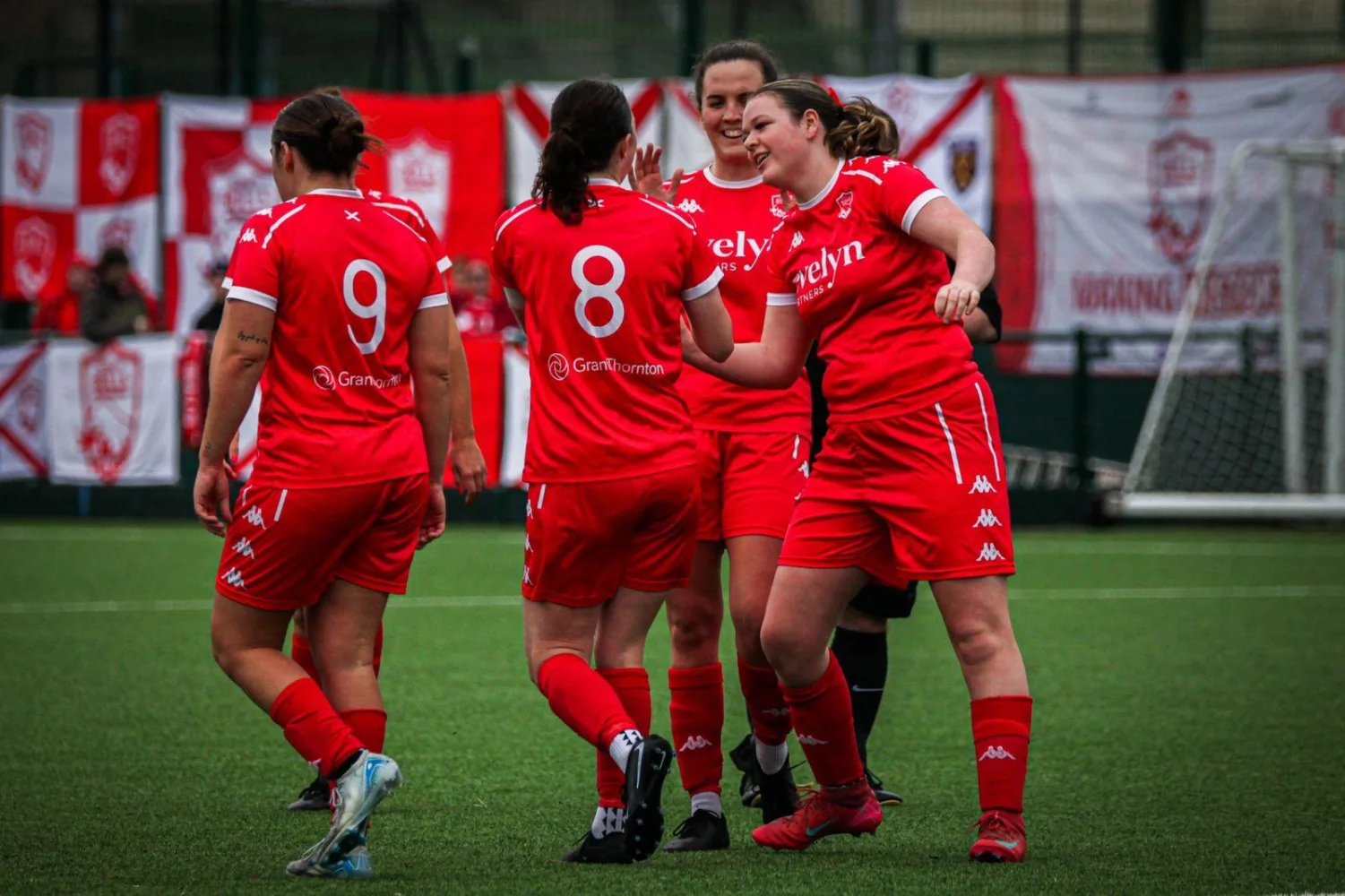Women's players celebrating
